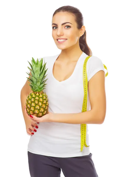 Mädchen mit Ananas isoliert — Stockfoto