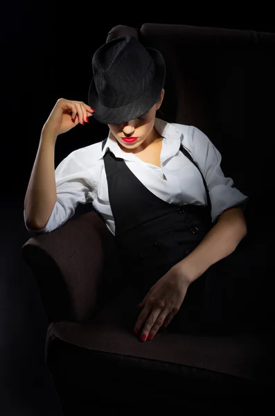 Woman with hat sit on chair — Stock Photo, Image