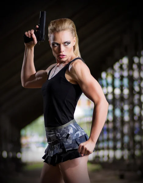 Woman in uniform with gun (normal version) — Stock Photo, Image