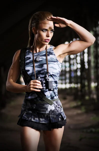 Woman in uniform with binoculars (dark version) — Stock Photo, Image