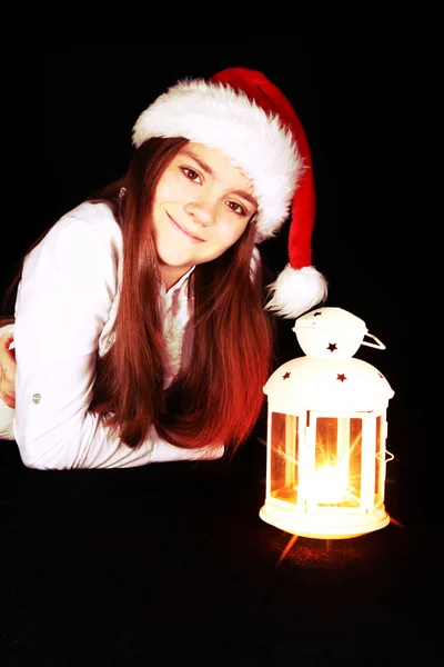 Christmas girl with lighting lantern over dark — Stok fotoğraf