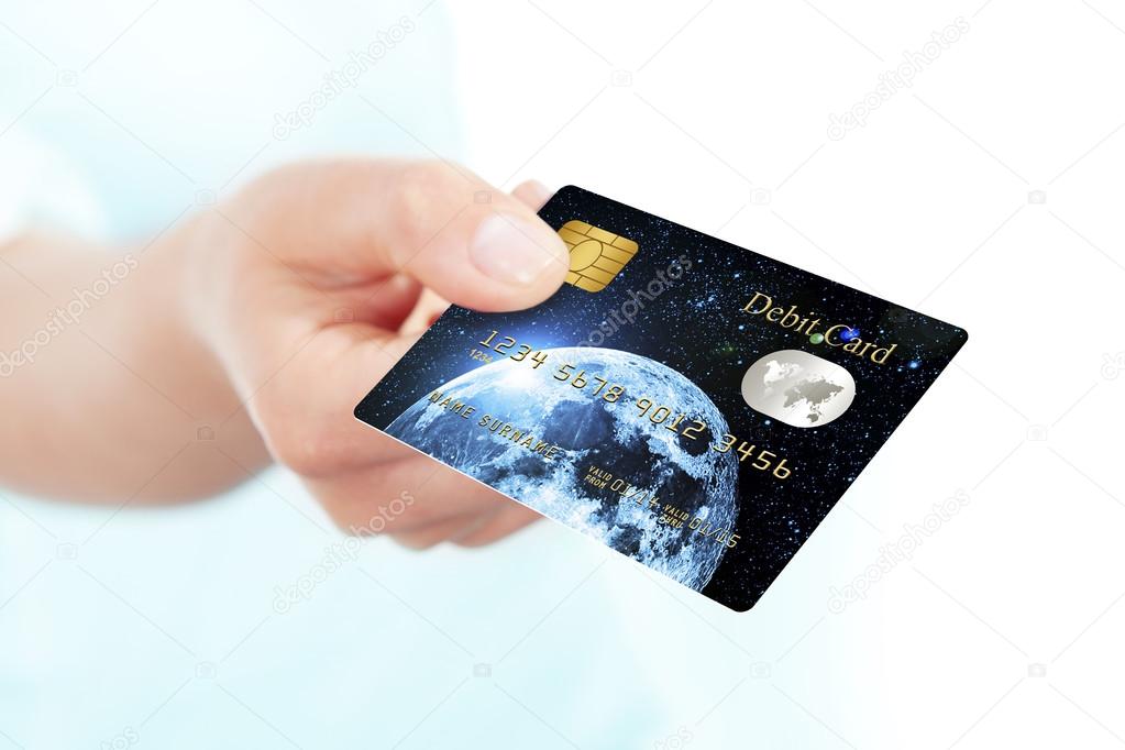 debit card holded by hand over white