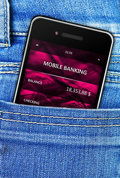 Мобильный телефон в кармане джинсовых брюк — стоковое фото