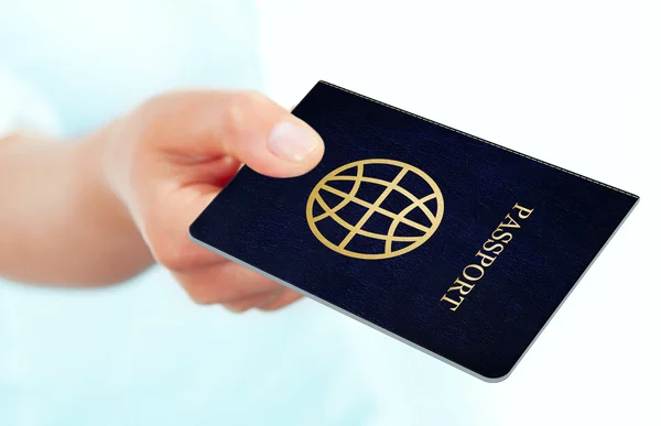 Hand holding passport over white background — Stock Photo, Image