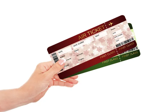 Hand holding christmas fly air tickets over white — Stock Photo, Image