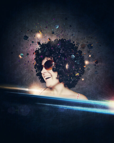 smiling woman with afro hair listen to music with headphones