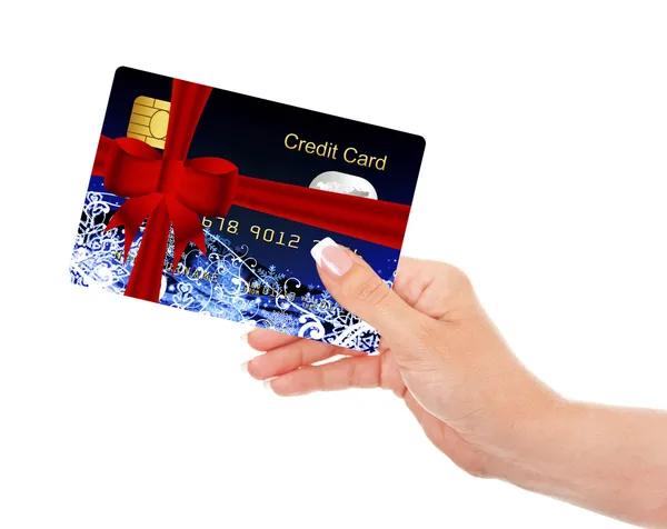 Mão segurando cartão de crédito Natal isolado sobre branco — Fotografia de Stock