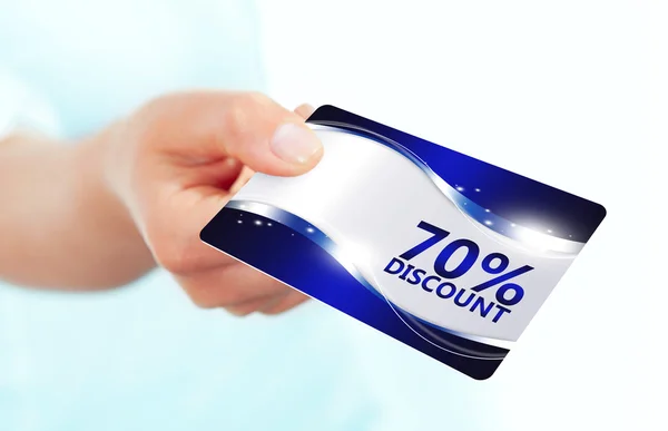 Hand holding red discount card isolated over white — Stock Photo, Image