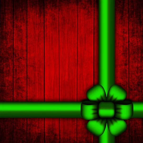 Wooden red christmas background with green ribbo — Stock Photo, Image