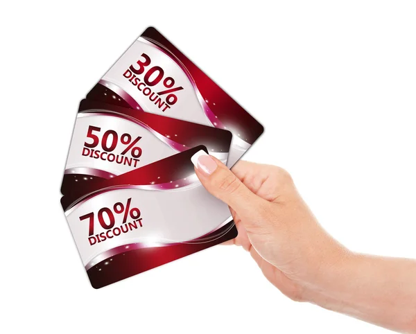 Hand holding red discount cards isolated over white — Stock Photo, Image