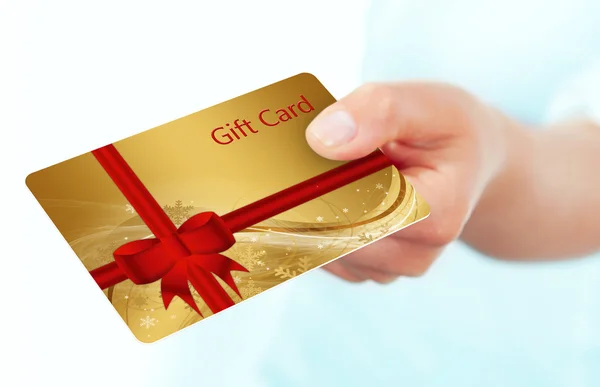 Hand holding gift card isolated over white — Stock Photo, Image