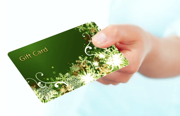 Hand holding gift card isolated over white — Stock Photo, Image