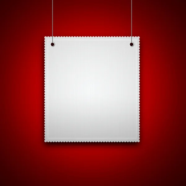 Blank hanging on red wall — Stock Photo, Image