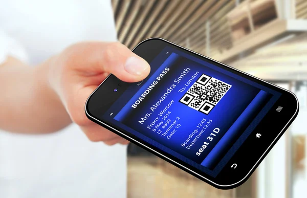 Hand holding mobile phone with mobile boarding pass — Stock Photo, Image