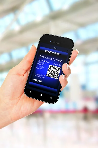 Hand holding mobile phone with mobile boarding pass — Stock Photo, Image