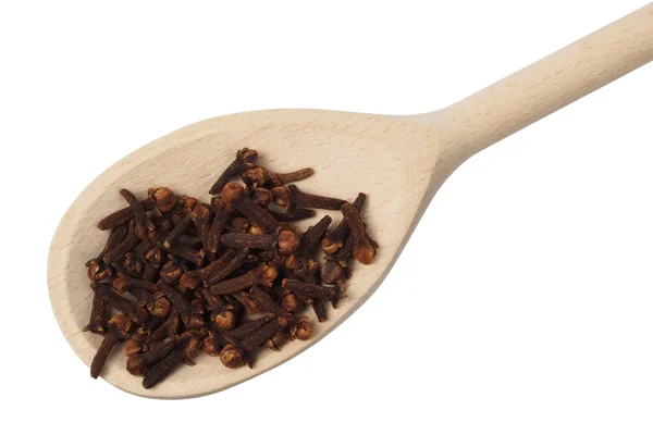 Spoon with cloves — Stock Photo, Image