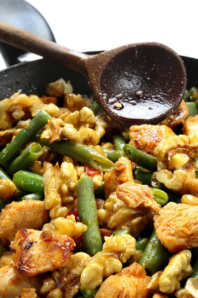 Green beans with chicken and walnuts — Stock Photo, Image