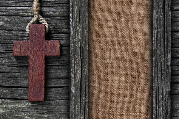 Background made of old wooden planks,cross and canvas — Stockfoto