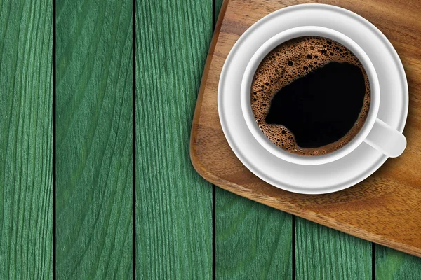 Kopje koffie op houten achtergrond — Stockfoto