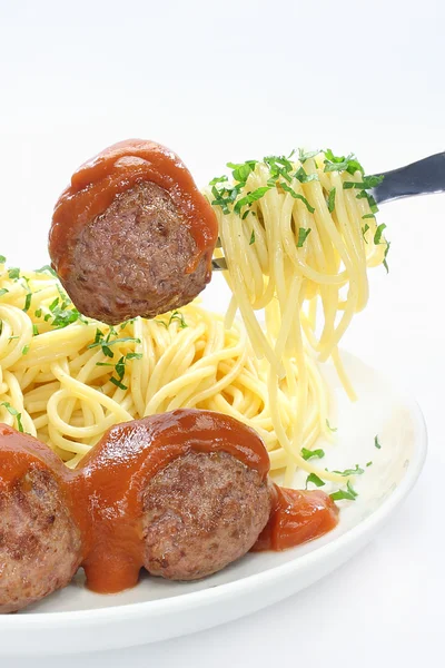 Fried pork meatballs with pasta — Stock Photo, Image