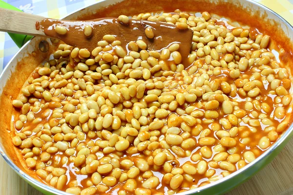 Soybeans with tomato sauce in the frying pan — Stock Photo, Image