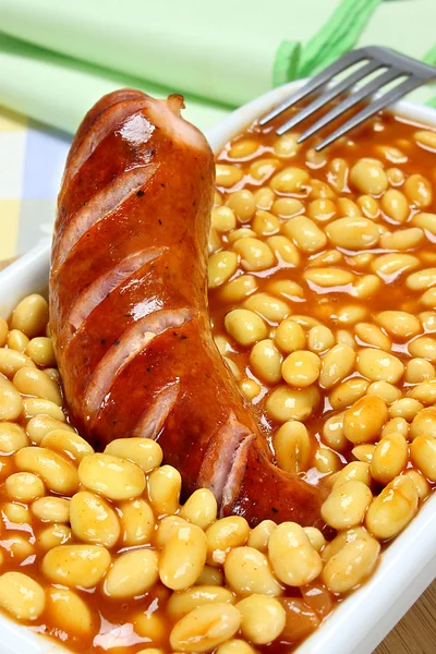 Soybeans with tomato sauce and fried sausage — Stock Photo, Image