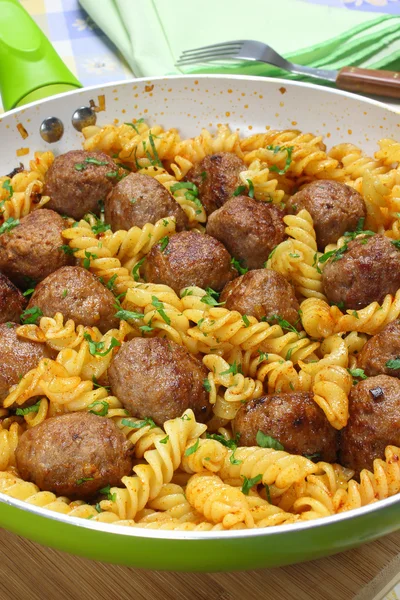 Fried pork meatballs with pasta — Stock Photo, Image