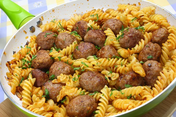 Fried pork meatballs with pasta — Stock Photo, Image