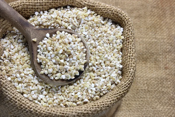 Pearl barley in canvas sack — Stock Photo, Image