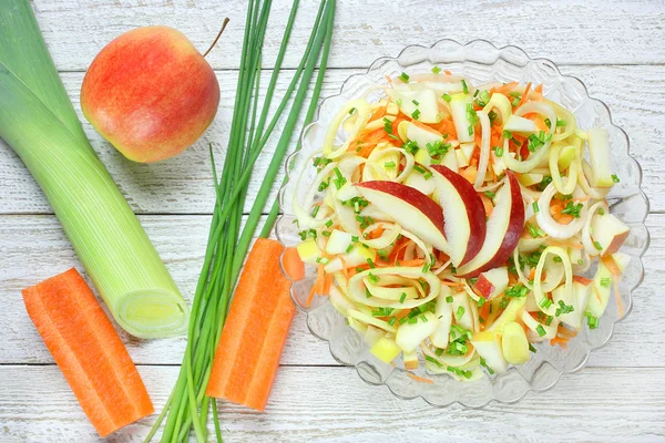 Salad with leek, carrots and apples Royalty Free Stock Photos