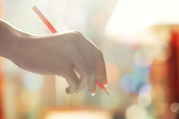 Hand with red pencil — Stock Photo, Image