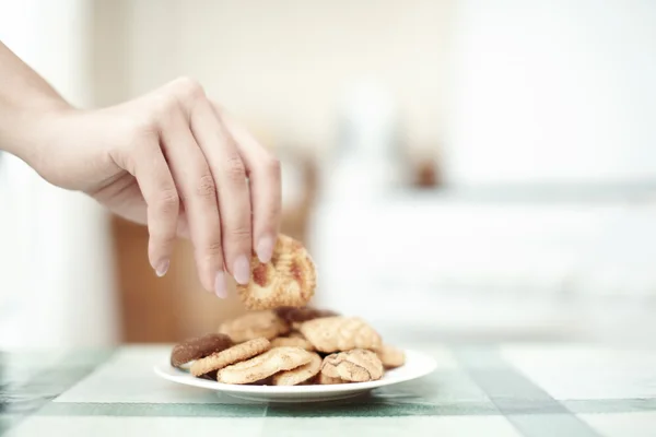 Tomando galletas —  Fotos de Stock