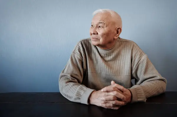 Pensive Thoughtful Senior Man Sitting Table Royalty Free Stock Images