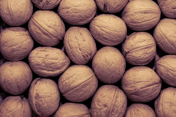 Group of walnuts as background — Stock Photo, Image