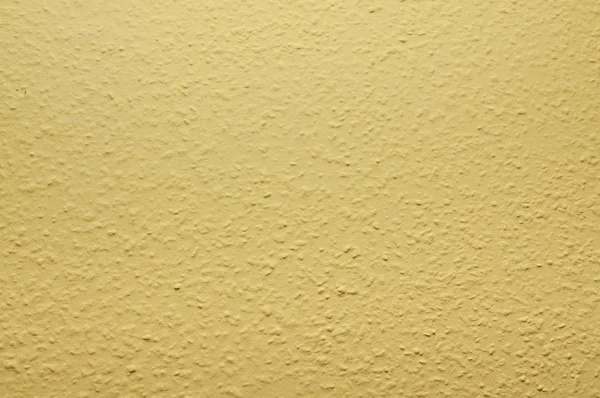 Amarelo pálido papel de parede pintado estrutural na parede — Fotografia de Stock