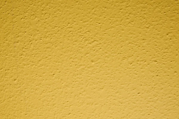 Amarelo pálido papel de parede pintado estrutural na parede — Fotografia de Stock