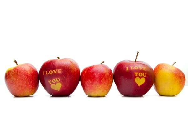 Apple met de woorden "i love you" gerangschikt in een rij — Stockfoto