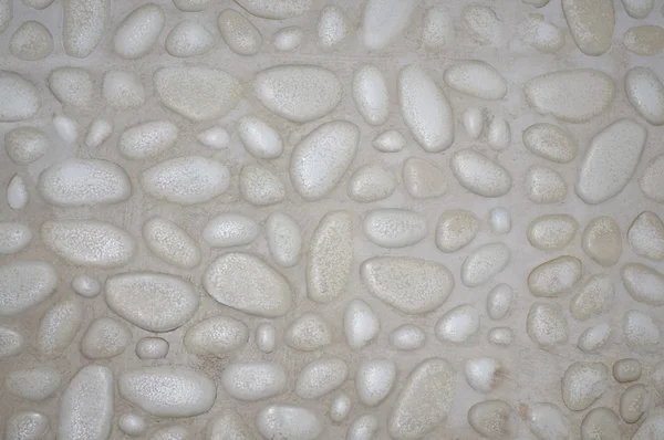 Fundo de parede de pedra texturizada com pequenas pedras e cimento — Fotografia de Stock