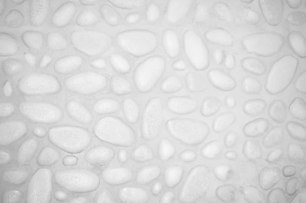 Texturerat stenmur bakgrund med små stenar och cement — Stockfoto