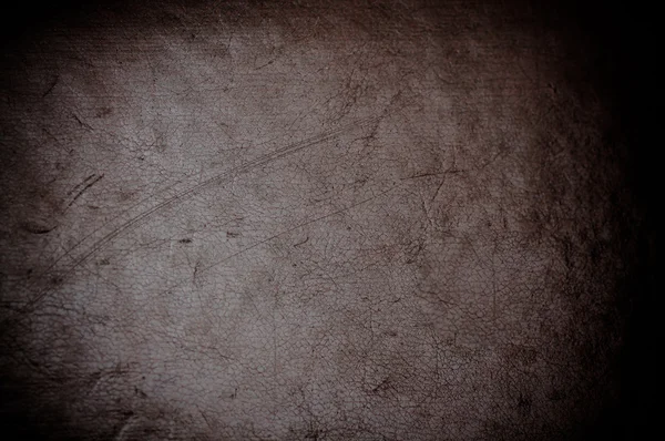 Dark grunge scratched leather to use as background — Stock Photo, Image