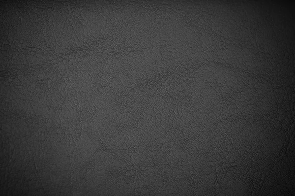 Dark grunge scratched leather to use as background — Stock Photo, Image