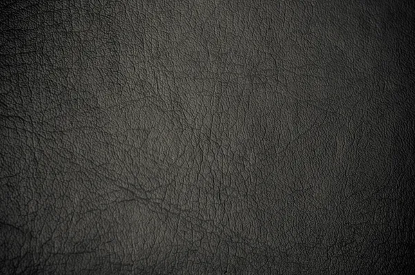 Темная тертая кожа для использования в качестве фона — стоковое фото