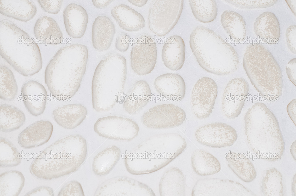 textured stone wall background with small stones and cement