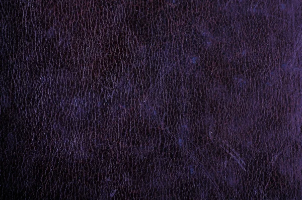 Dark grunge scratched leather to use as background — Stock Photo, Image