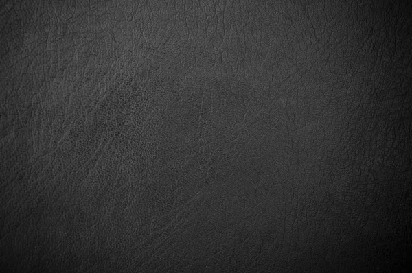 Dark grunge scratched leather to use as background — Stock Photo, Image
