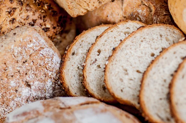 Group of different bread's type on wooden table — Stock Photo, Image