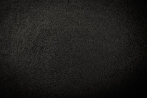 Dark grunge scratched leather to use as background — Stock Photo, Image