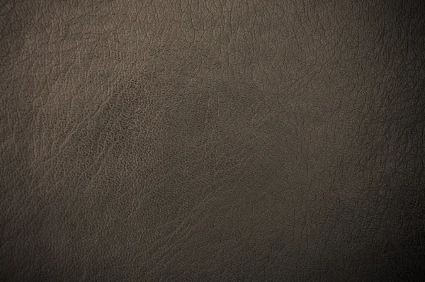 Dark grunge scratched leather to use as background — Stock Photo, Image