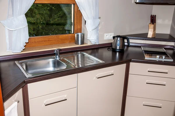 New kitchen interior with brown top table — Stock Photo, Image