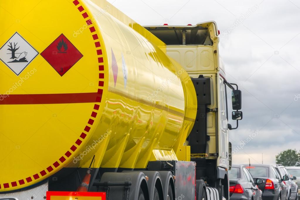 yellow fuel tank standing in a traffic jam